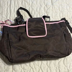 Carters brown/pink large diaper bag. Plastic lined w/ pockets & clips stroller.